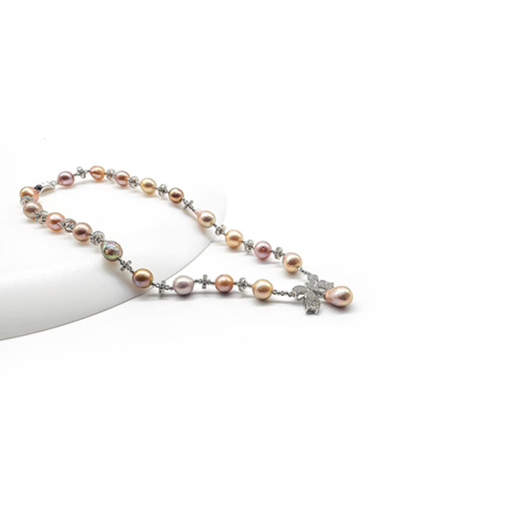 Bold ,Baroque pearl Bow necklace on sterling silver with cubic zirconia.