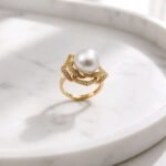 Waridi Ring -genuine pearl and layered petals with cubic zirconia in silver with a gold-plated finish