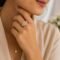 model wearing Malkia Ring -cluster of genuine pearls with cubic zirconia, crafted in sterling silver