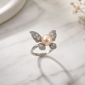Kipepeo Ring- luminous peach freshwater pearl with cubic zirconia wings in sterling silver
