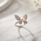 Kipepeo Ring- luminous peach freshwater pearl with cubic zirconia wings in sterling silver